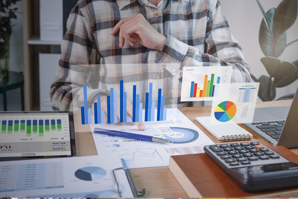 Photo conceptuelle d'une personne en arrière-plan analysant des statistiques