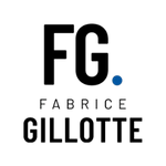 Mostly black image featuring a single small, bright blue circular highlight near the top center.