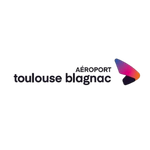 Brand logo with the name 'toulouse blog' in dark letters and a pink-purple gradient swoosh emblem on the right.